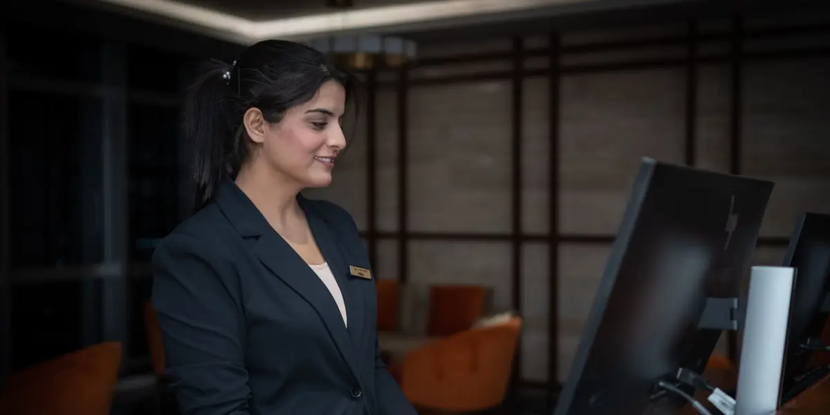 A receptionist at a front desk